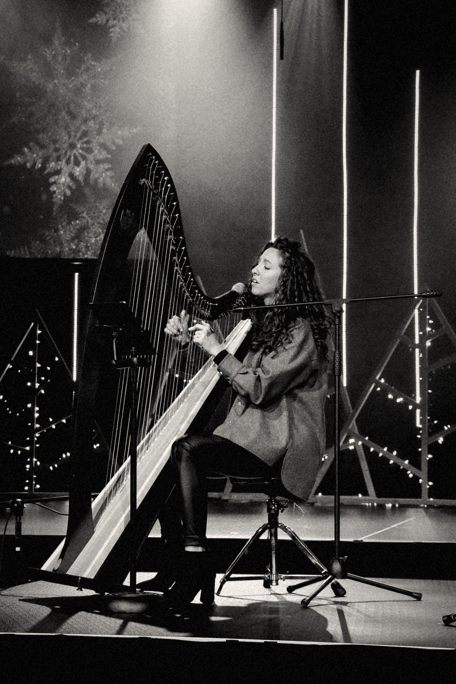 A harpist playing on the Real Life stage